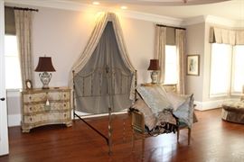 King-Sized metal bed frame with canopy accent, Hooker Furniture Co. locking bedside chests, pair of table lamps
