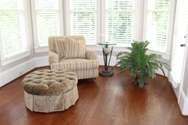 Henredon upholstered chair, Drexel Heritage upholstered, tufted ottoman, faux palm in footed urn, glass and metal side table