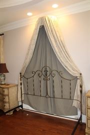 Detail of the king-sized bed headboard and canopy accent