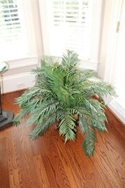 Faux palm in footed urn