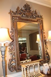 Detail of the ornate carved gilt finished mirror in the dining room