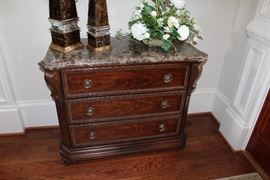 Bernhardt marble topped chest, pair of Currey & Co. decor obelisks, faux flower arrangement
