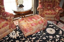 Highland House upholstered ottoman and chairs, marble-topped side table, area rug