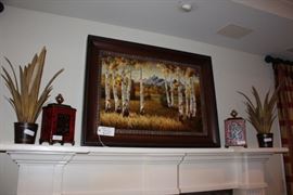 Framed oil painting depicting aspen trees during fall with a mountain-scape in the background, lidded-canisters, metal home decor accents