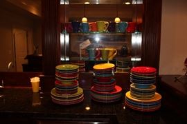 Colorful Neiman Marcus plates, bowls and mugs