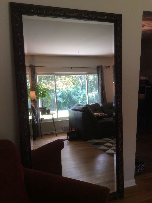 Large mirror with carved frame, also has wire for hanging horizontally
