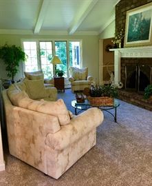 Couches and chairs, coffee tables, decorations, pictures