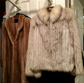 Fur coats.  One is mink other is silver fox