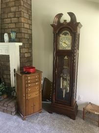 Jewelry hutch and Grandfather Clock.  