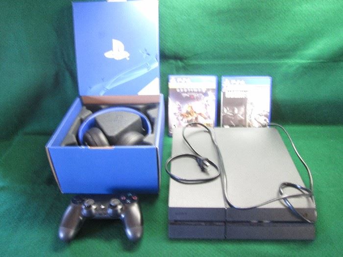 Sony PS4 with headphones and 2 games