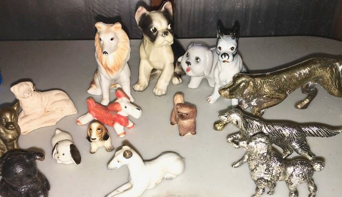 Miniature pups, including brass, cast-metal and cast iron Hubley dog (left corner)