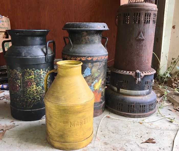 Painted milk cans and antique heater