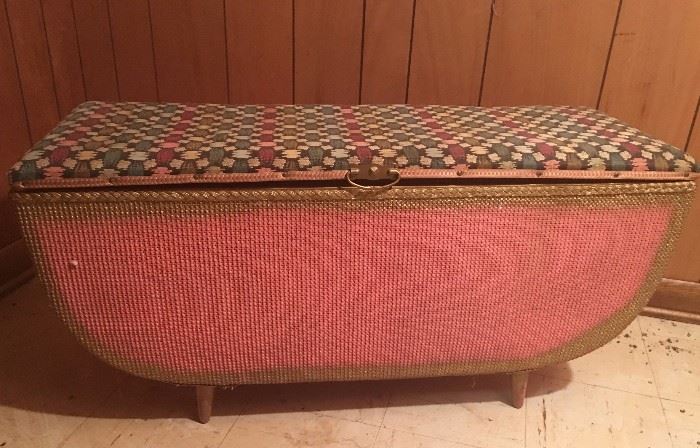 A stunning mid-century pink rattan blanket chest with upholstered lid