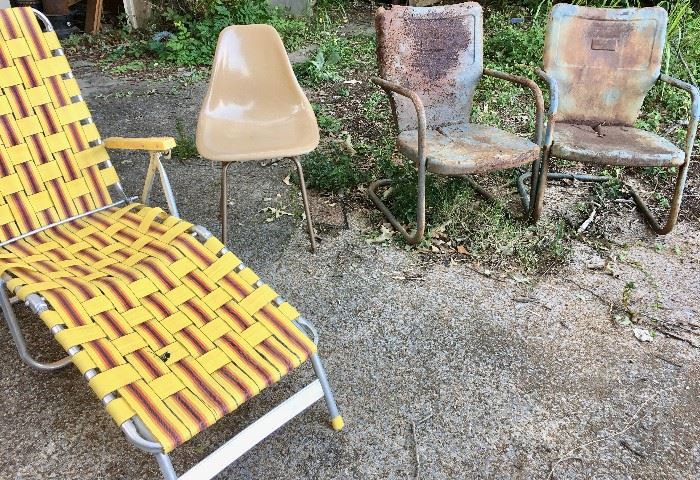 A selection of old but desirable chairs--aluminum-framed lounger, MCM molded fiberglass side chair, metal porch rockers
