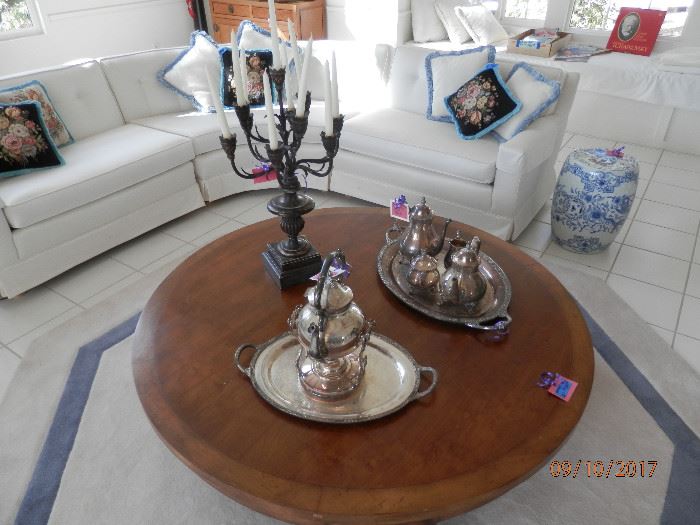 Another shot of the coffee table, sectional and silver coffee service.