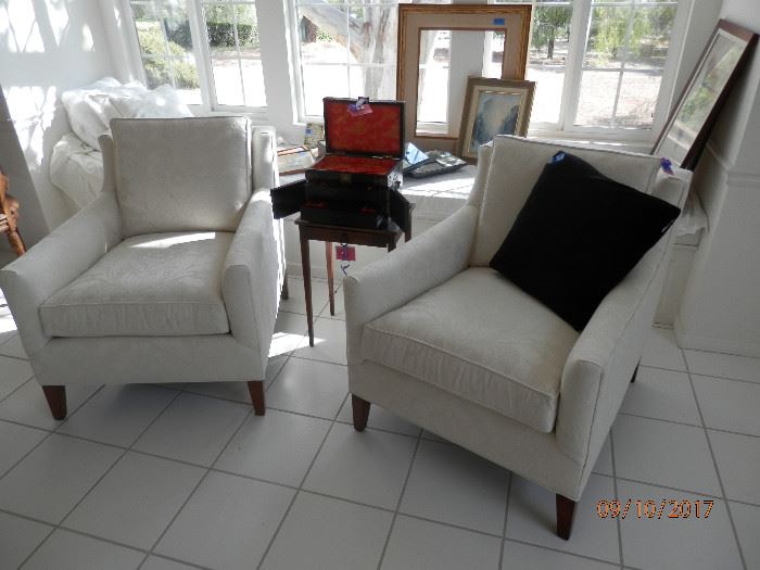 Matching pair custom ivory brocade upholstered chairs in top shelf condition.  Were covered with sheets .