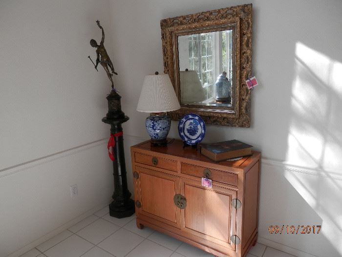 Solid teak Contemporary Asian buffet....finished on all sides...rear included.   Large beveled mirror which matches the one in the entry....so there are a total of 2. 