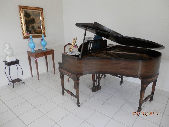 Everett baby grand....nice but needs LOTS of TLC.  Two french blue decanters on inlaid table with drawer.