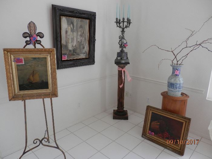 OLD 1894 oil on canvas on left and nice still life oil on canvas on right leaning up against late 18th century French wine stand.  Many nice paintings on display for sale.