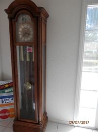 Howard Miller Grandfather Clock...moon phase dial, Westminster Chime, bevel glass door...full functioning.