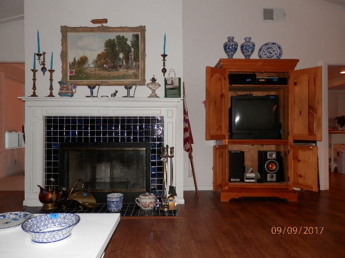 Oil on canvas country farm scene painting above fireplace and much decor.    Yellow pine entertainment / storage armoire.  