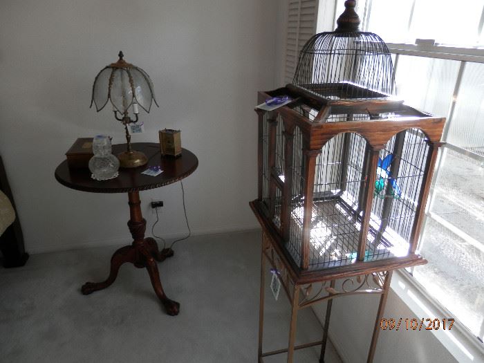 Birdcage on wrought iron stand....nice round 3 leg carved table....mahogany, newer