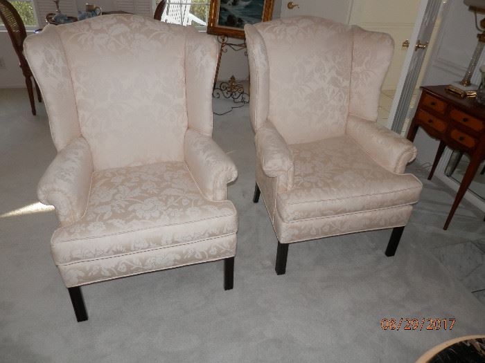 Matching pair Queen Anne wing back chairs...Fabric is Ivory Floral Brocade 