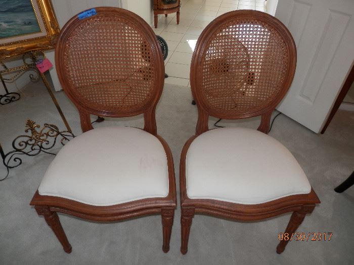 King Louis style antique cane chairs.   There are 4 