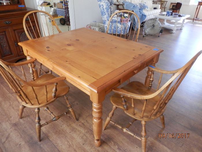 Country style Yellow pine 2 drawer dining table....also has 18" leaf.   4 Ethan Allen oak arm chairs....all items solid as a rock.