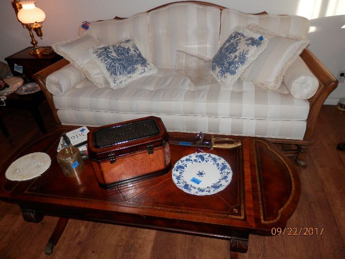 Cane sofa with ivory brocade cushions and bolsters. caning perfect.  Leather top drop leaf coffee table...matches leather top step table