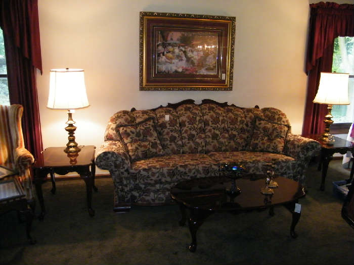 overstuffed style sofa with carved frame that has a matching lounge sofa, carved frame. paisley style fabric.