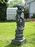 Owner liked statuary and the yard has a collection of various forms,