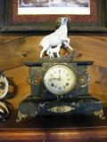 The owner added this bisque mountain sheep to the clock but it looks good with it. Many bisque animals and birds in the sale. Good quality.