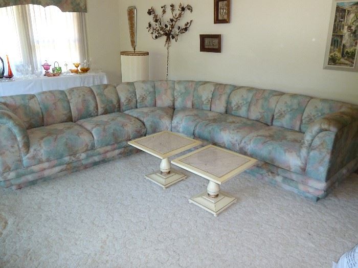 Heavy, well made, sectional sofa.  Three pieces, curved styling, soft blues, pinks and tans.