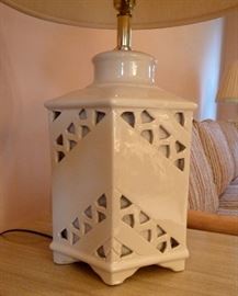Pair of porcelain table lamps. Cream color with cut-out decoration.
