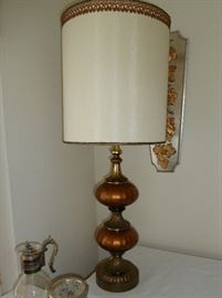 Extra large table lamp, copper glass and brass base with foliage motif, decorative trim on shade, measures 43" tall.
