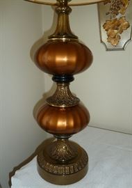Extra large table lamp, copper glass and brass base with foliage motif, decorative trim on shade, measures 43" tall.