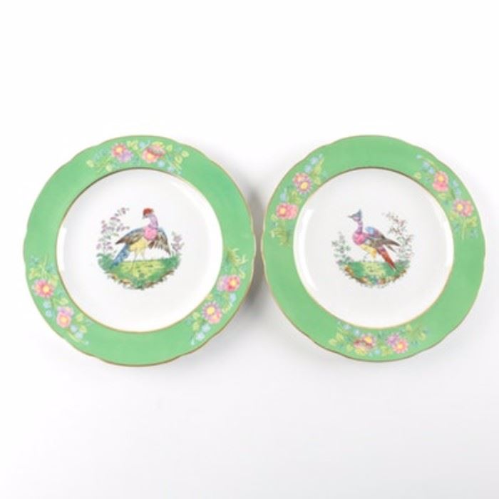 Copeland Spode English Plates: A pair of English Spode plates from Copeland. Both of these plates have gilt exterior and interior edges with green and floral trim between. Along the center of either is a bird depiction, and to the underside are marks that bring both from England and Spode.