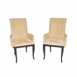 "Barbaltadue" Armchairs by Smania: A pair of Barbaltadue armchairs by Smania. This pair feature beige suede-like upholstery in a zebra stripe texture, with three buttons down the front left and right of the backrest, with slightly rolled crests to the tops. The arms are slightly curved around alongside the square seats. The chairs rise on cabriole style legs, in a dark espresso finish. The chairs are marked “Smania Italy” to the bottom.