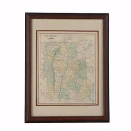 Vintage Lithograph Print on Paper of a Political Map of New Hampshire & Vermont: A vintage lithograph print on paper of a political map of New Hampshire and Vermont. This map depicts major roads, highways, and mountains in black ink with differently colored counties and regions. To the lower right, it is marked “L.B. Folger Sc. Cin.” This print is presented under layered mats and glass, in a wood frame with hanging wire affixed to the verso.