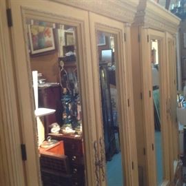 Pairof Neoclassic style two door mirrored armoires