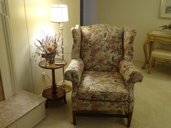 Upholstered wing chair & Weiman round table.