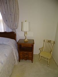 One of two end tables which is part of the king size bedroom suite.