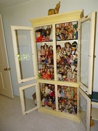 Doll collection.  Curio cabinet is also for sale.