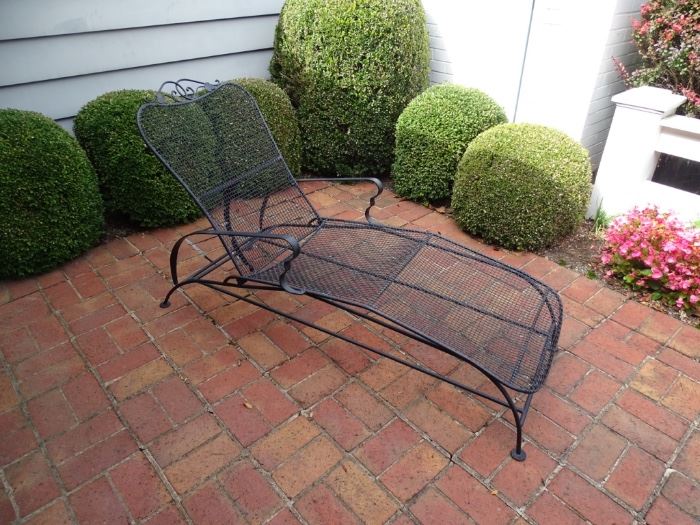 Wrought iron chaise lounge.