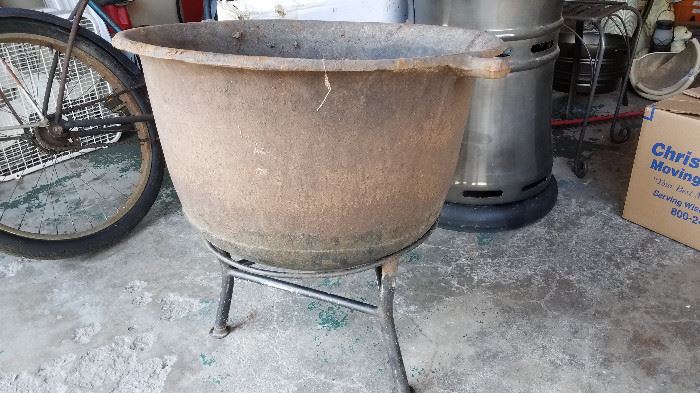 Large iron pot on stand