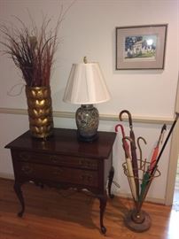 Antique marble base umbrella stand with vintage umbrellas and walking stick' gold metallic "leaf' umbrella stand used as vase, lamp, low boy