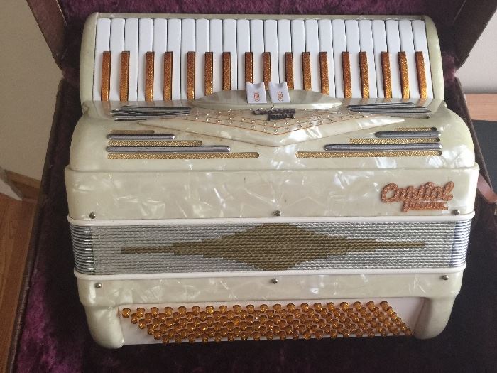 vintage Capitol Deluxe accordion with case.  Mother of Pearl and gold accents