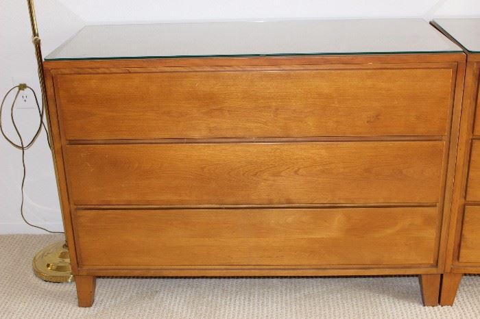 One of two matching three drawer chests.