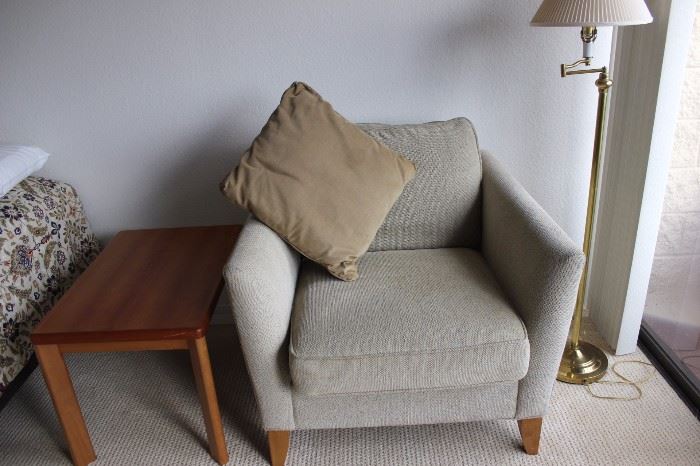 Armchair that matches the couch, one of two matching end tables.